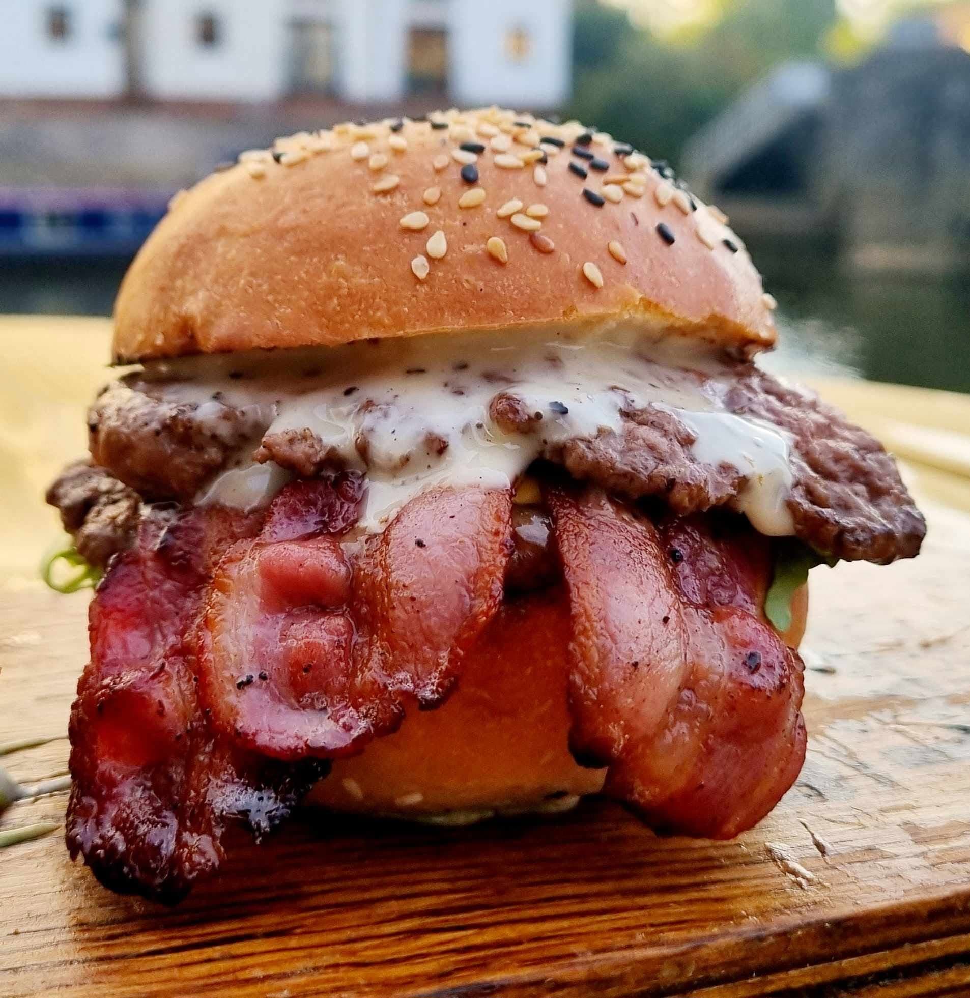 Loaded smash burger stacked high with bacon and cheese